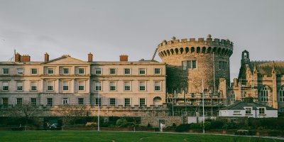 Dublin Castle by Alexandra Mitach_Unsplash Vintage Dublin Castle with architectural groves and curves. Bright green grass in the foreground.