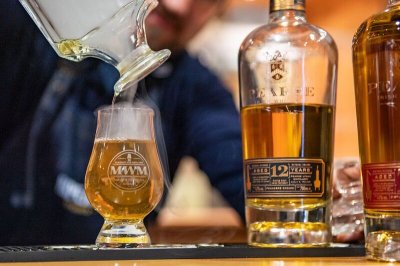 12 Year Old Single Malt image of bottle of whiskey and glass with whiskey inside