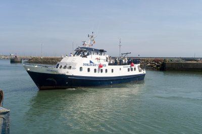 irish bay cruises at howth  boat in the water at howth harbour