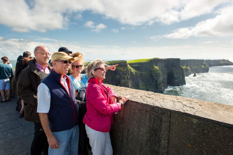 Cliffs of Moher © Christopher Hill Photographic 2014, Tourism Ireland people looking beside cliffs and the sea