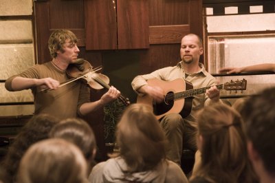 Musical Pub Tour Instrument two men playing guitar and fiddle