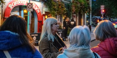 Original Dublin Haunted tour Woman with white blonde hair talking to crowd during haunted tour